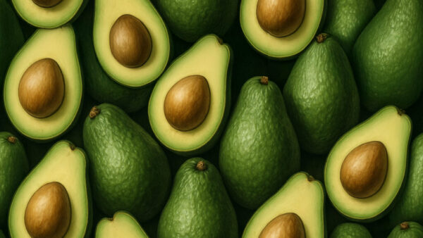 Flat lay of whole and halved avocados in seamless pattern on dark green background in 16:9 format
